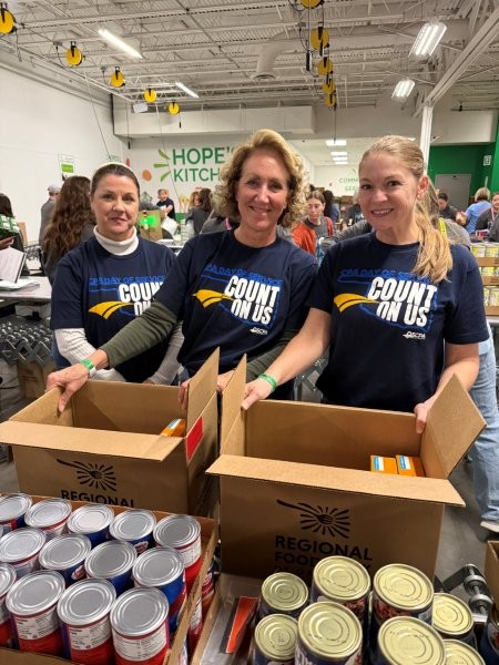 Wedel Rahill team members packing food at regional food bank